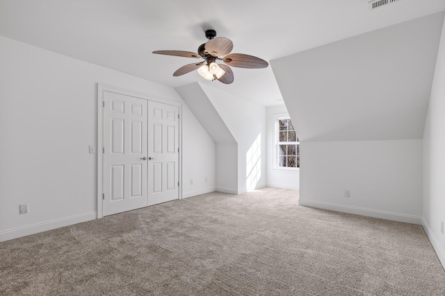 bonus room featuring carpet floors, ceiling fan, and vaulted ceiling