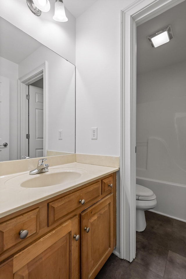 bathroom with toilet and vanity