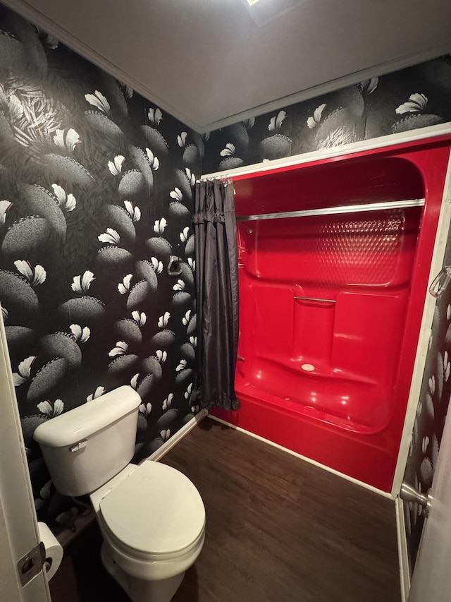 bathroom featuring toilet and hardwood / wood-style flooring