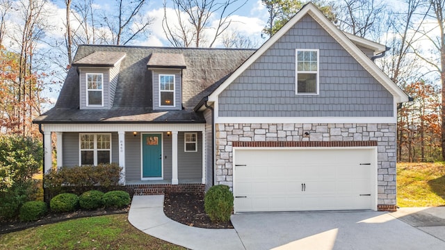 view of front of house featuring covered porch and a garage