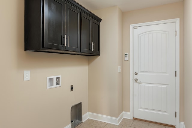 laundry room with cabinets, washer hookup, light tile patterned floors, and electric dryer hookup