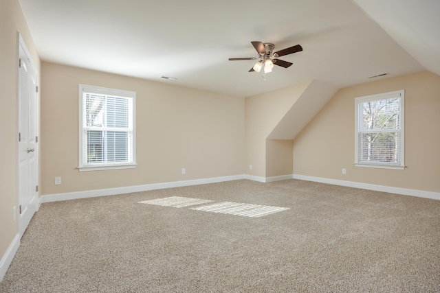 bonus room with ceiling fan, carpet, and vaulted ceiling