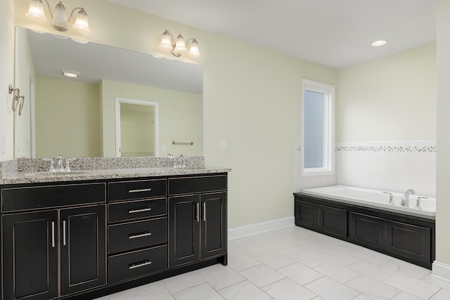 bathroom featuring vanity and a bathtub