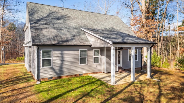 rear view of property with a patio area and a yard