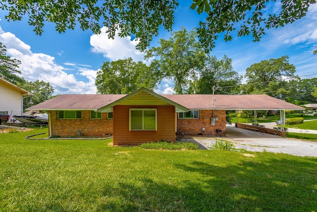 4701 Maywood Ln, Chattanooga, TN 37416 - ranch-style home with a carport, brick siding, concrete driveway, and a front yard