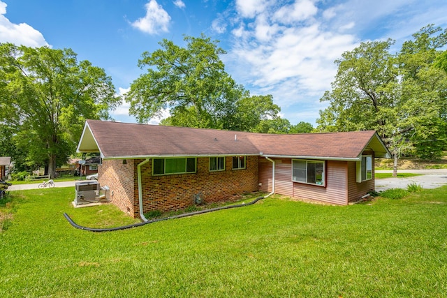 4701 Maywood Ln, Chattanooga, TN 37416 - view of front of property featuring a front lawn, brick siding, and a shingled roof