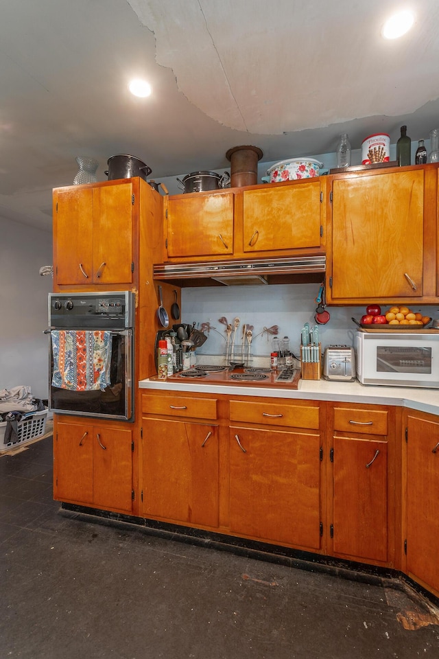 4701 Maywood Ln, Chattanooga, TN 37416 - kitchen with stainless steel appliances, ventilation hood, brown cabinets, and light countertops