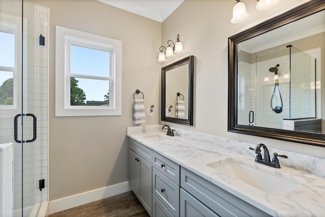 155 Surrey Ln NE, Cleveland, TN 37312 - bathroom with double vanity, a stall shower, wood finished floors, and crown molding