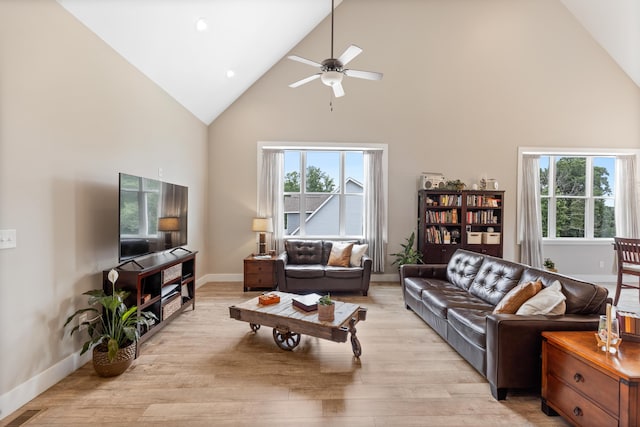 155 Surrey Ln NE, Cleveland, TN 37312 - living room featuring high vaulted ceiling, plenty of natural light, a ceiling fan, and light wood-type flooring