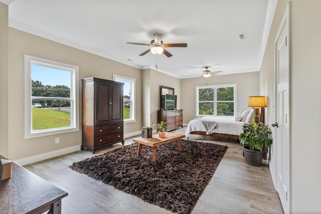 155 Surrey Ln NE, Cleveland, TN 37312 - bedroom with light wood finished floors, ornamental molding, and ceiling fan