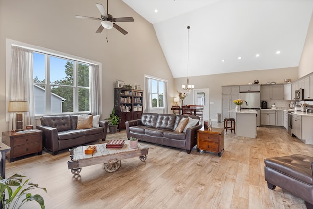 155 Surrey Ln NE, Cleveland, TN 37312 - living area featuring high vaulted ceiling, light wood finished floors, a chandelier, and a ceiling fan