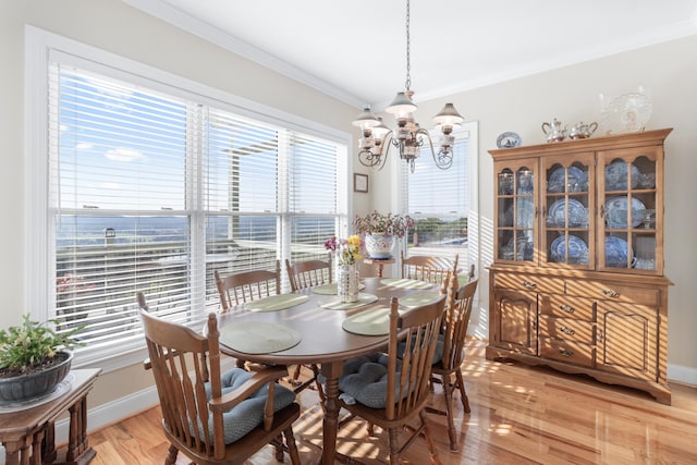 103 Windcrest Pl NW, Cleveland, TN 37312 - dining room with a chandelier, healthy amount of natural light, light wood-style flooring, ornamental molding, and baseboards