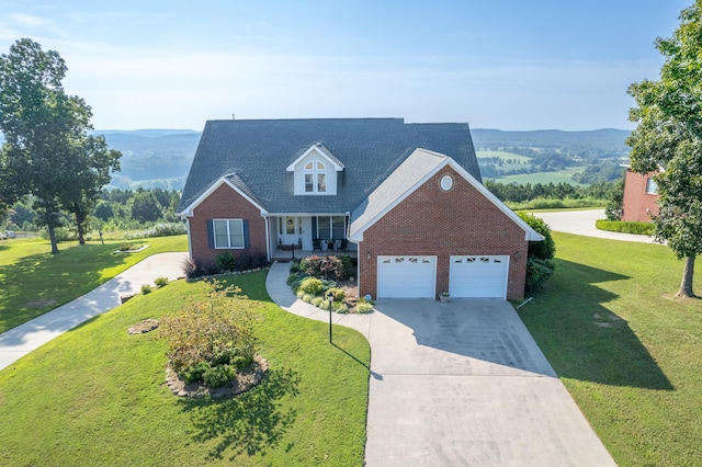 103 Windcrest Pl NW, Cleveland, TN 37312 - view of front facade featuring brick siding, a porch, concrete driveway, a front yard, and a mountain view