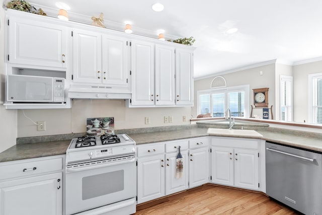 103 Windcrest Pl NW, Cleveland, TN 37312 - kitchen featuring white appliances, a sink, under cabinet range hood, crown molding, and white cabinets