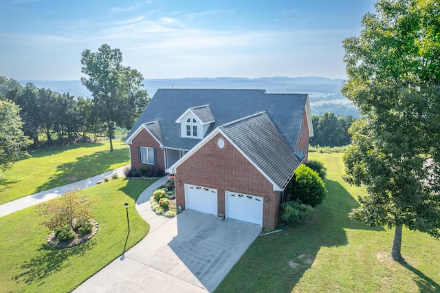 103 Windcrest Pl NW, Cleveland, TN 37312 - view of front facade with brick siding, concrete driveway, an attached garage, and a front yard