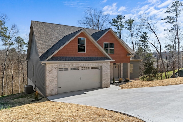 craftsman house featuring central AC and a garage