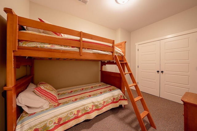 bedroom featuring a closet and carpet