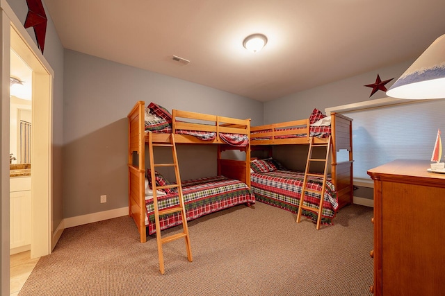 bedroom featuring carpet floors, baseboards, and visible vents