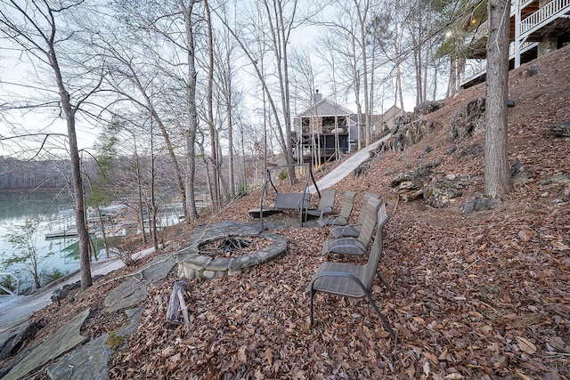 view of yard with a fire pit