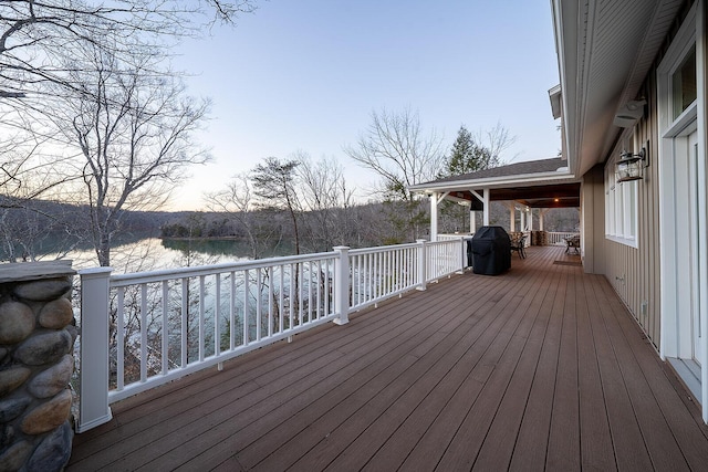 wooden deck featuring a water view