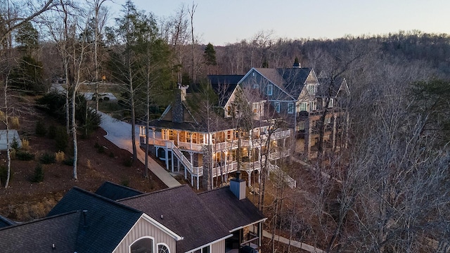 exterior space featuring a forest view