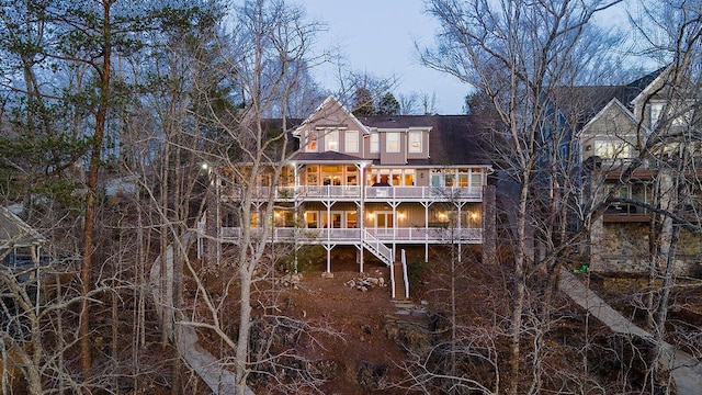 rear view of property with stairway