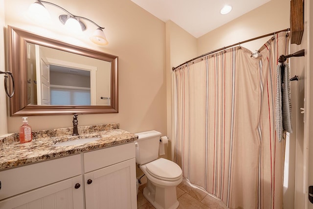 bathroom with toilet, a shower with curtain, tile patterned flooring, and vanity