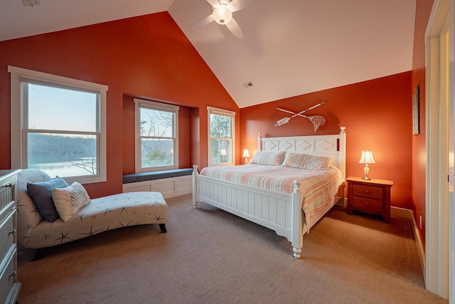 bedroom with ceiling fan, high vaulted ceiling, carpet flooring, and visible vents