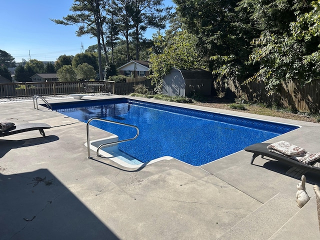 view of pool with a patio area, a fenced backyard, and a fenced in pool