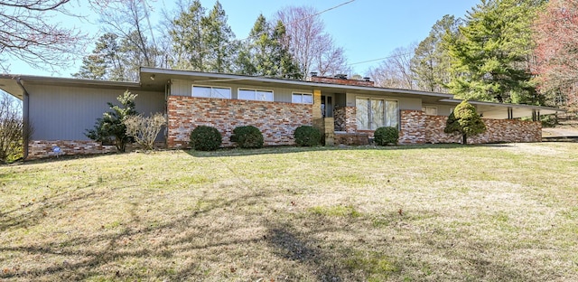 mid-century modern home with a front lawn and brick siding