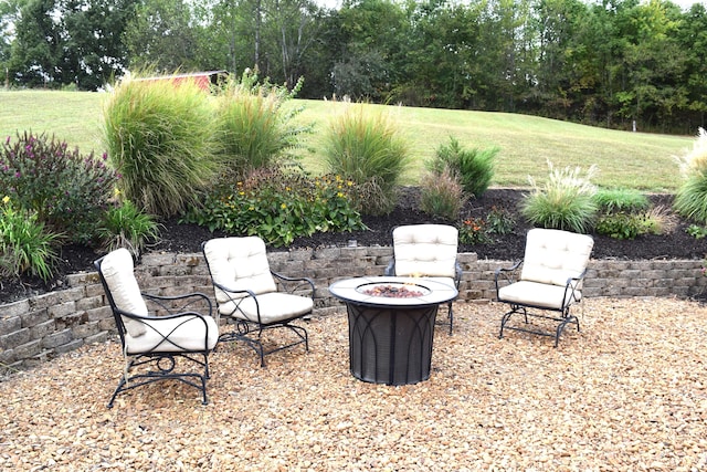 view of patio featuring an outdoor fire pit