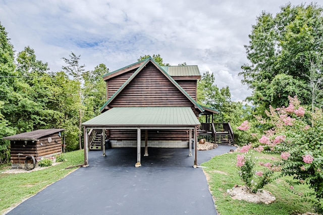 view of home's exterior featuring a carport