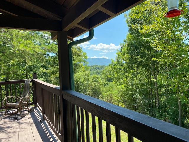 wooden balcony featuring a deck