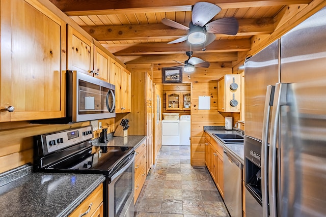 kitchen featuring washer and clothes dryer, wooden ceiling, sink, appliances with stainless steel finishes, and beamed ceiling