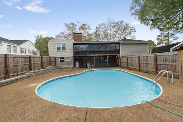 view of swimming pool with a deck