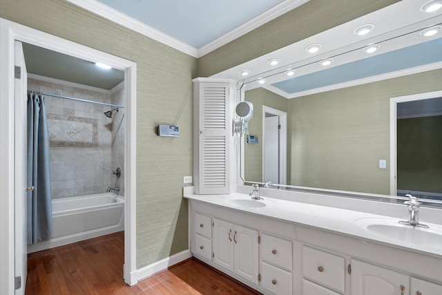 bathroom featuring shower / tub combo with curtain, vanity, ornamental molding, and hardwood / wood-style flooring