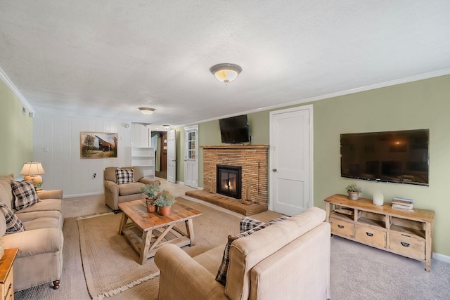 carpeted living room featuring ornamental molding and a textured ceiling