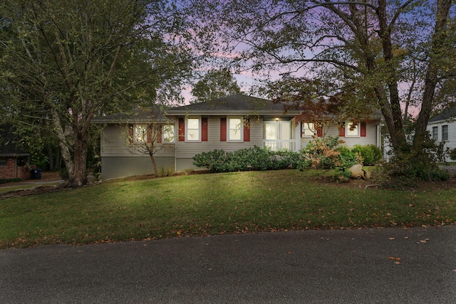 view of front of house with a lawn