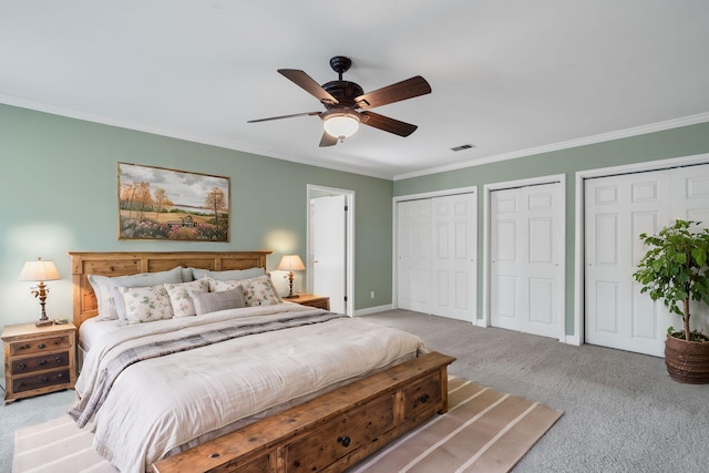 bedroom with light carpet, multiple closets, ceiling fan, and crown molding