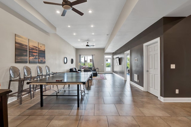 rec room featuring tile patterned flooring and ceiling fan