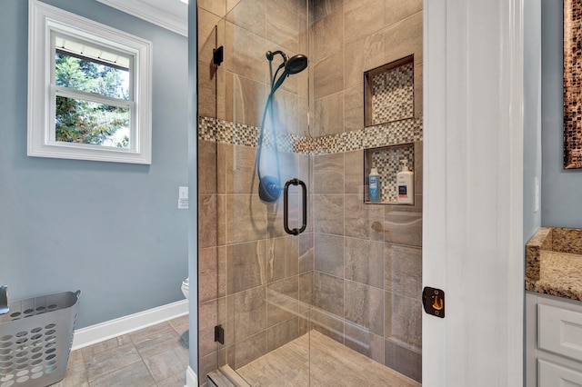 bathroom with walk in shower, vanity, crown molding, tile patterned flooring, and toilet