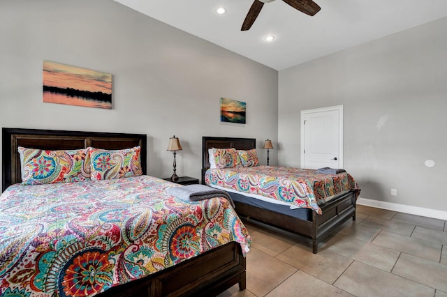 tiled bedroom featuring ceiling fan and high vaulted ceiling