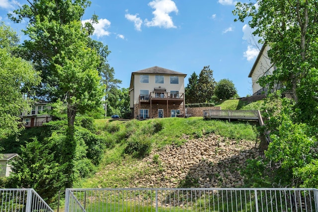 back of property featuring a deck