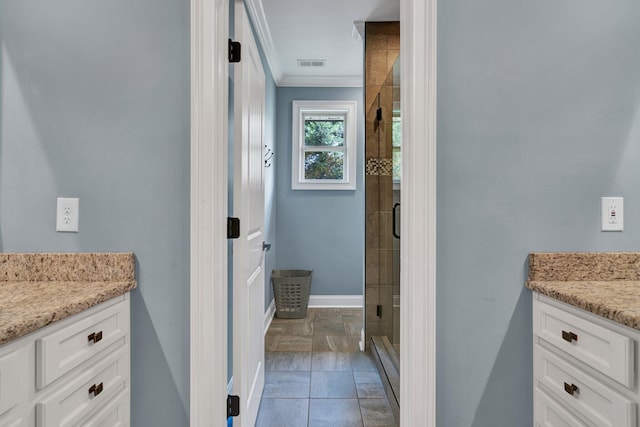 bathroom with walk in shower, vanity, and ornamental molding