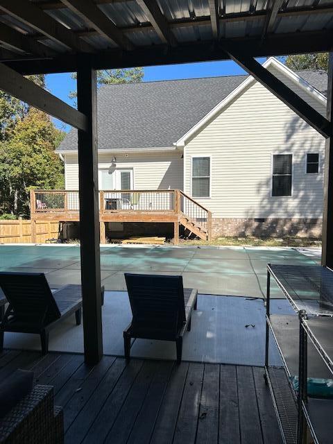 view of swimming pool featuring a wooden deck