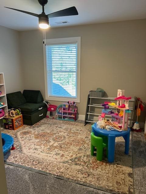 game room featuring carpet flooring and ceiling fan