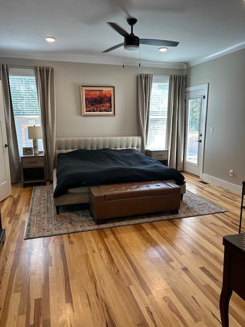 bedroom featuring light wood-type flooring, access to outside, ceiling fan, and crown molding