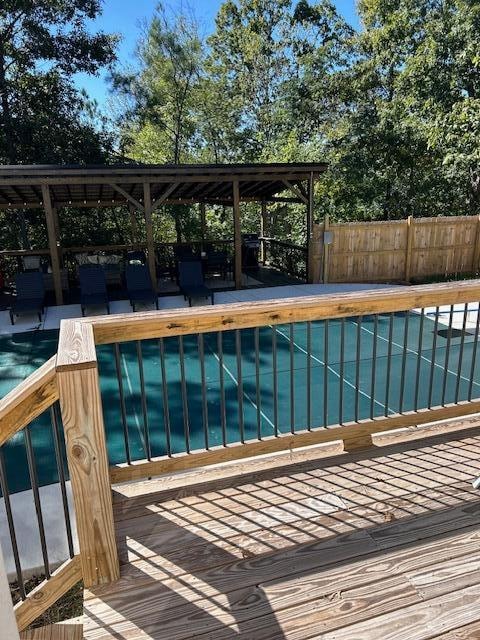 view of pool with a wooden deck