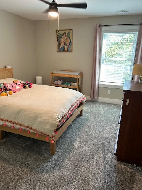 bedroom with ceiling fan and carpet floors