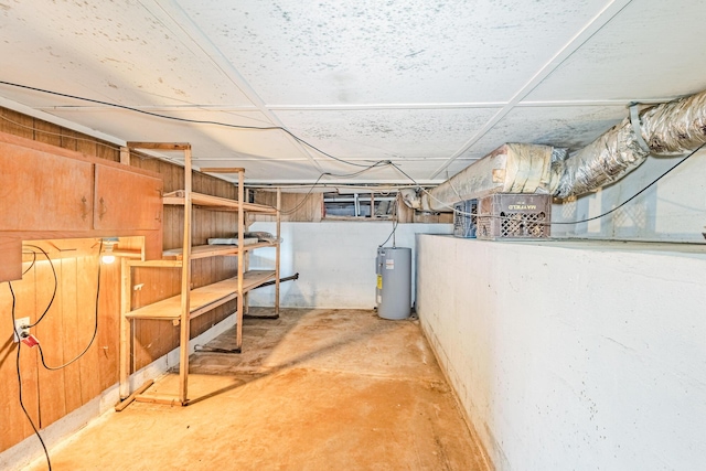 unfinished basement with electric water heater